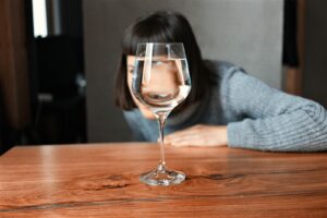 clear wine glass on brown wooden table